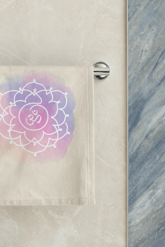 "Crown Chakra hand towel with Sahasrara symbol, promoting spiritual connection, neatly hanging from a steel bar in the bathroom."
