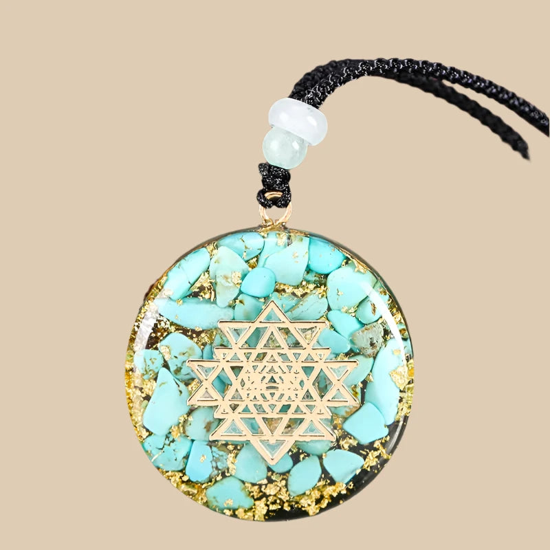 Lifestyle shot of a woman wearing a turquoise orgonite necklace with Sri Yantra, representing peace and tranquility.