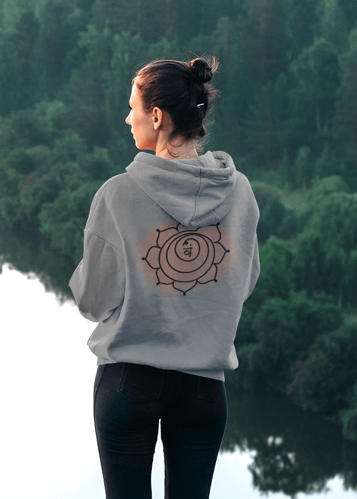 Back view of a black hoodie with a prominent Svadhisthana chakra design. A spiritual wardrobe essential by Inkasis.